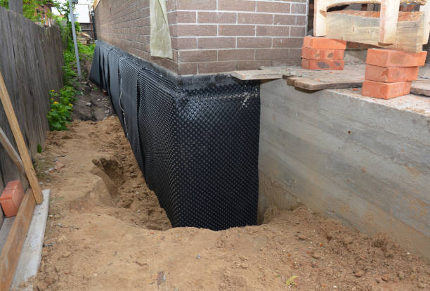 Happy homeowners after waterproofing job in Russiaville